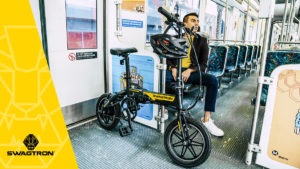 Guy sitting on the bus with his EB5 eBike.