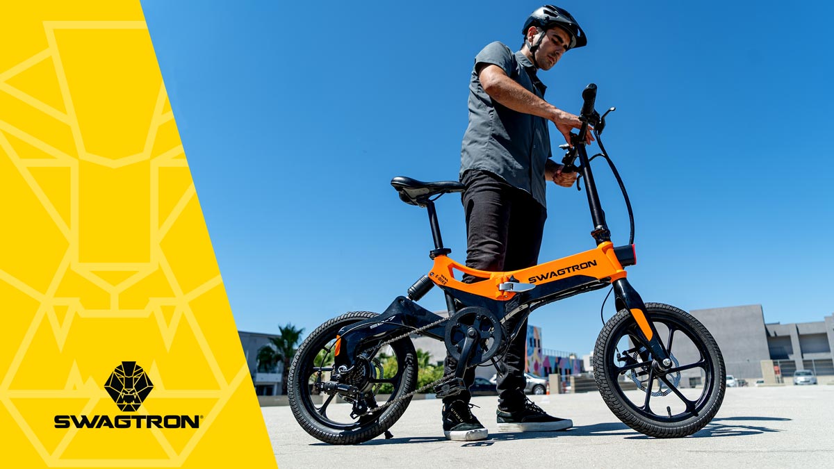 Guy wearing a helmet standing next to his EB7 Plus eBike.