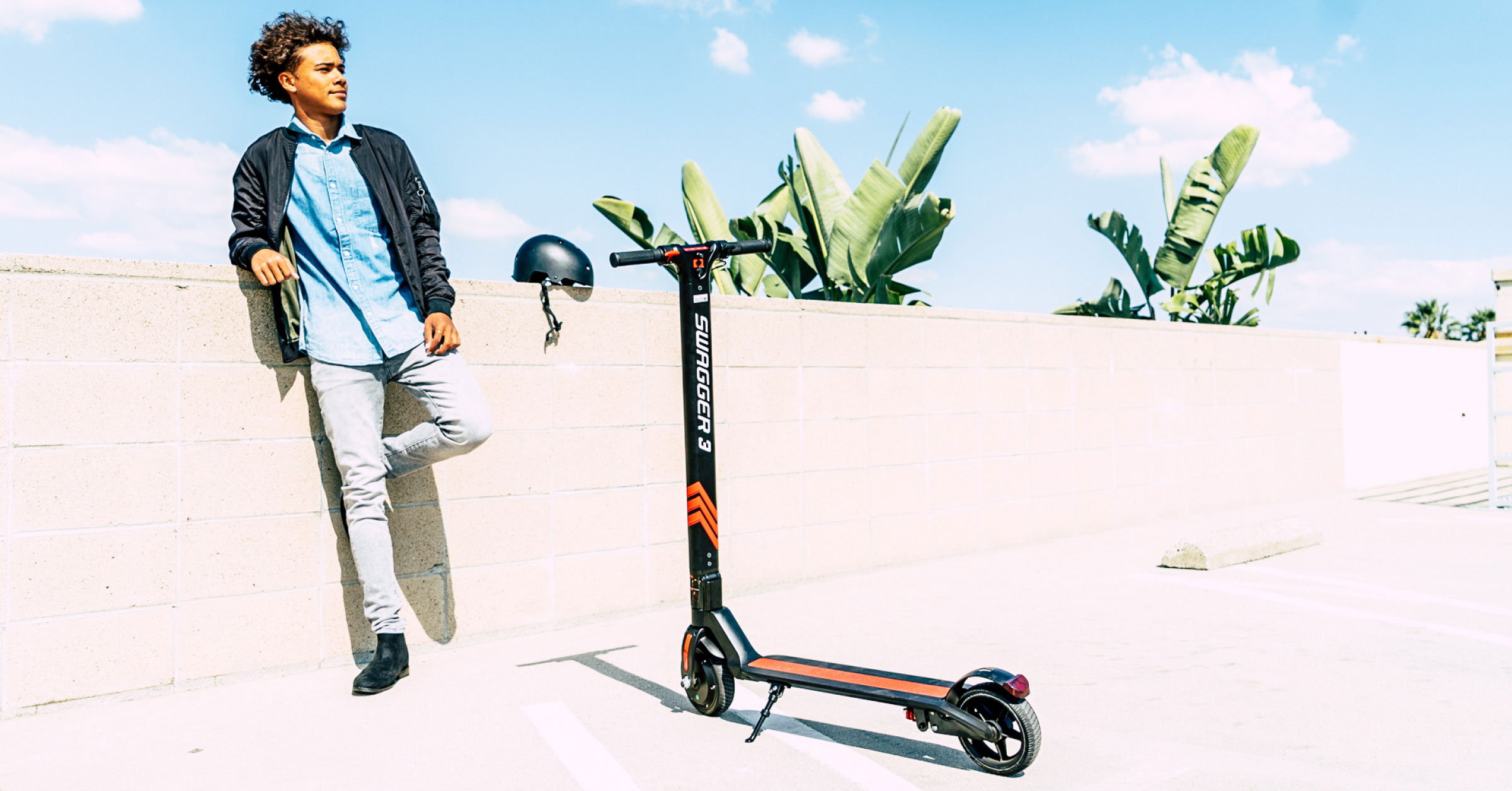 eScooter with helmet next to a wall