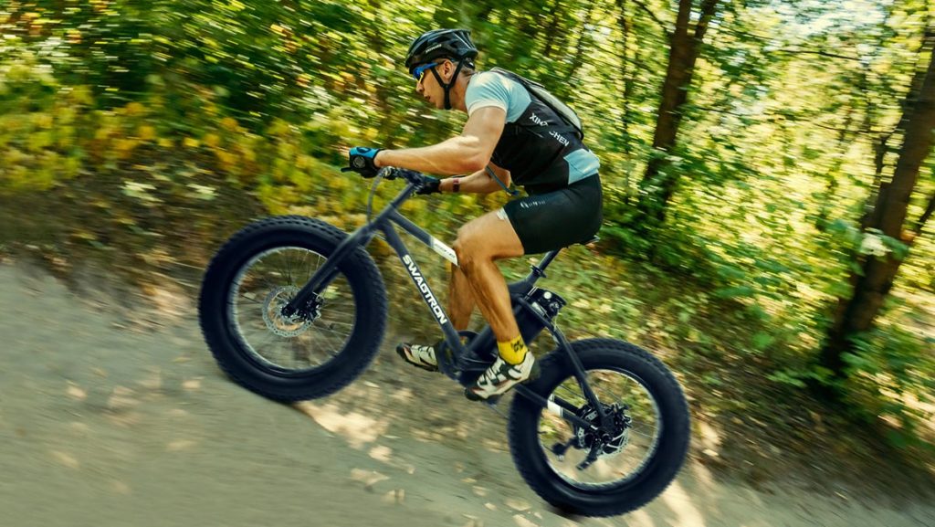 Older man riding on an uphill trail with his EB8 Fat-Tire eBike.