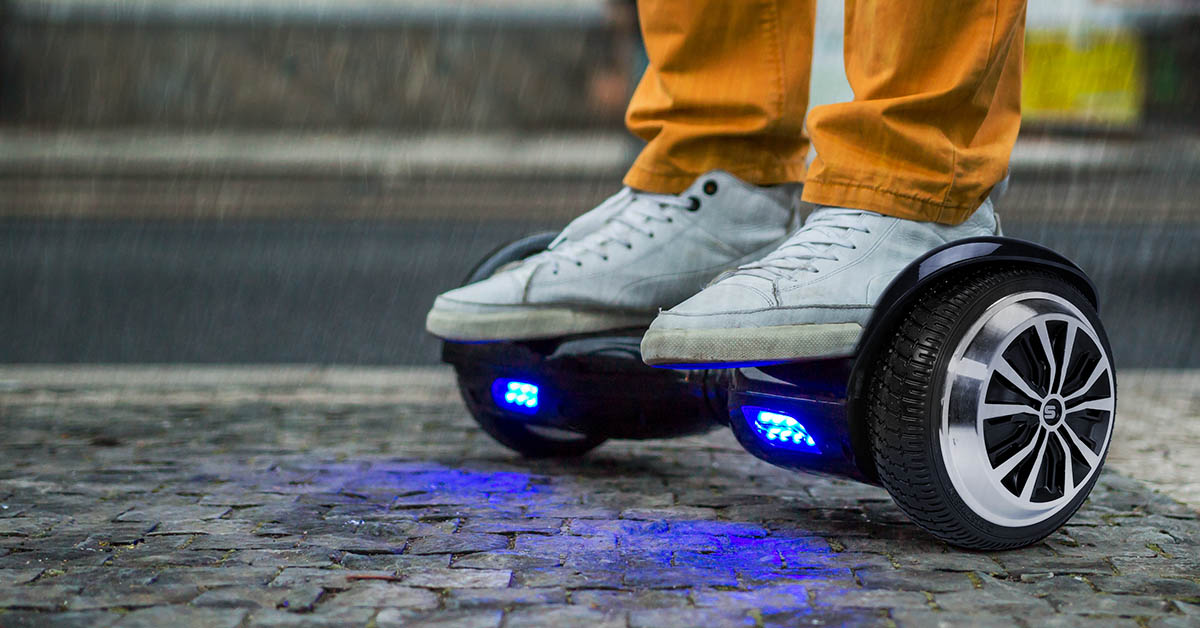 Close-up of a hoverboard being ridden in the rain (not recommended)