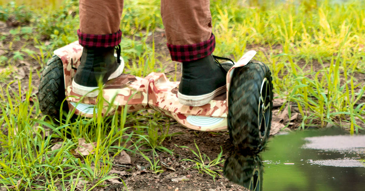 Close-up of the T6 Outlaw hoverboard being ridden next to a puddle