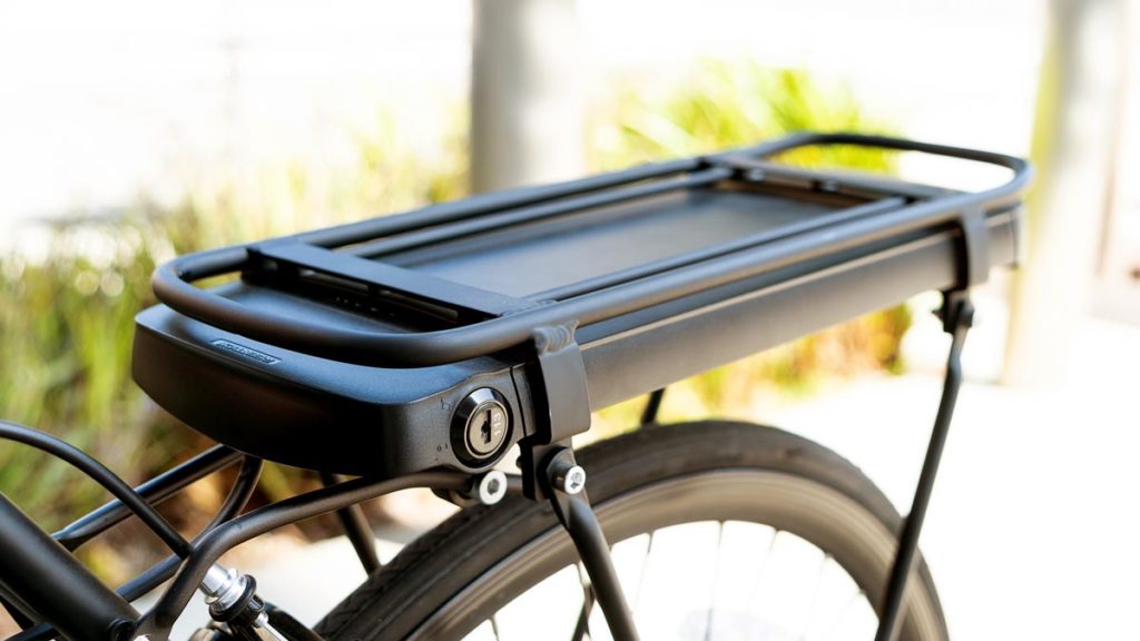 Closeup of the bike rack with removable battery of some SWAGTRON EB-Series eBikes.