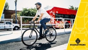 Man wearing a helmet riding an EB12 electric bike