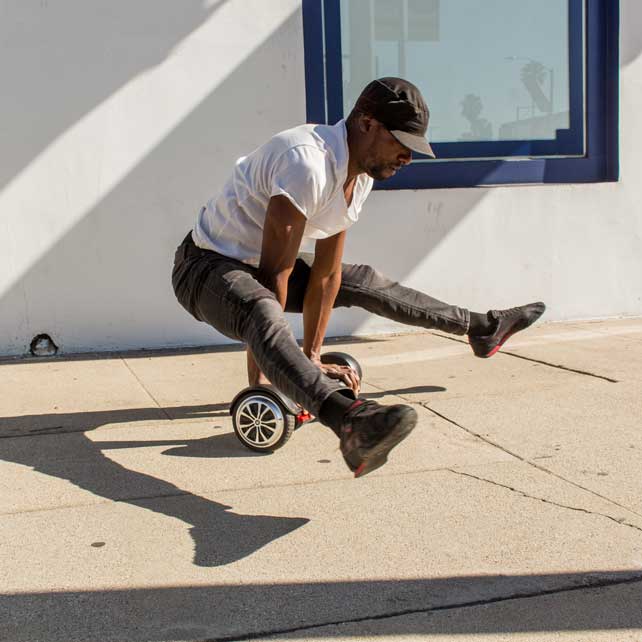 Man doing trick on black hoverboard