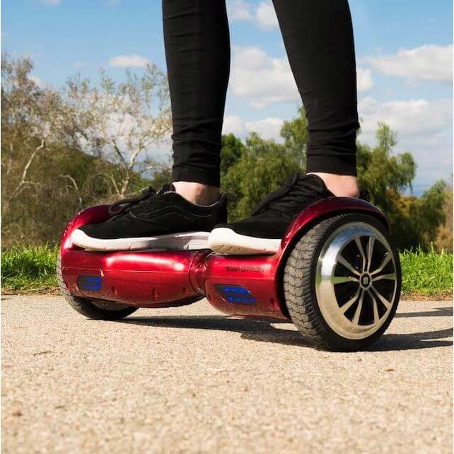 Woman riding red hoverboard in park